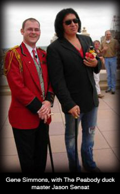 The Peabody duck master Jason Sensat with Gene Simmons