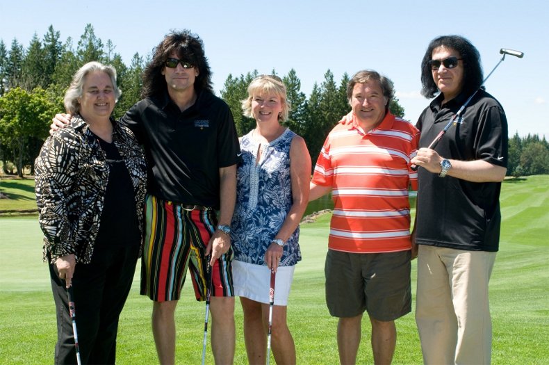 Pacific University president Lesley Hallick, Tommy Thayer, trustee Nancy Phillips, Paul Phillips and Gene Simmons