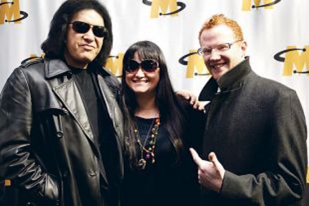 Shelley Chase of St. John's-based Garrison Hill Entertainment (centre) poses with Gene Simmons (left) and Momentum Group CEO Brad LeBlanc after the recent Atlantic Brand Cofabulation in Moncton, N.B.